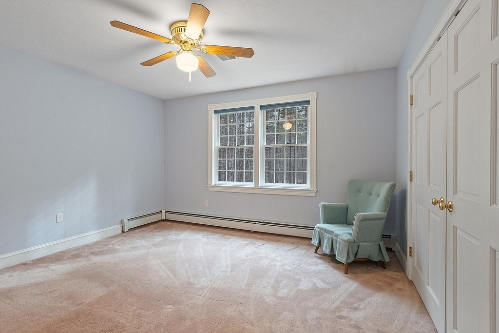 96 Cedarwood Road Boxborough, MA 01719 - Photo 27 of 41 a living room with furniture and a window