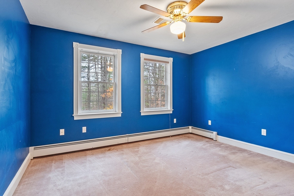 96 Cedarwood Road Boxborough, MA 01719 - Photo 29 of 41 an empty room with windows and fan