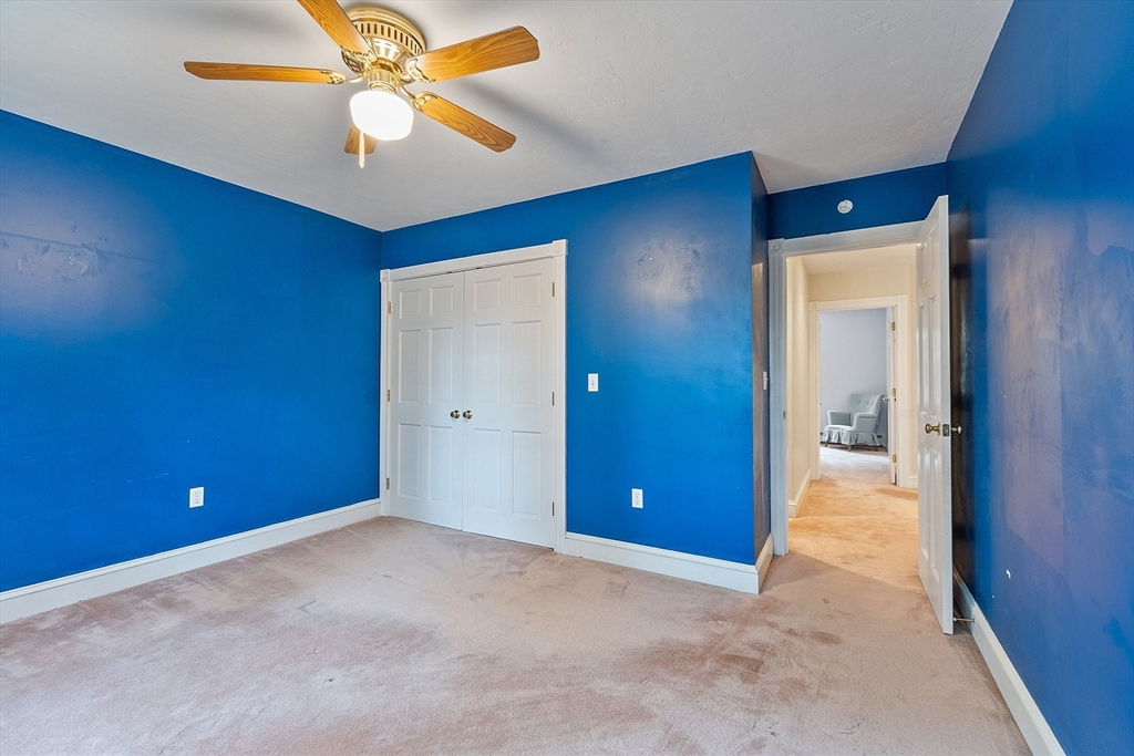 96 Cedarwood Road Boxborough, MA 01719 - Photo 30 of 41 an empty room and chandelier fan