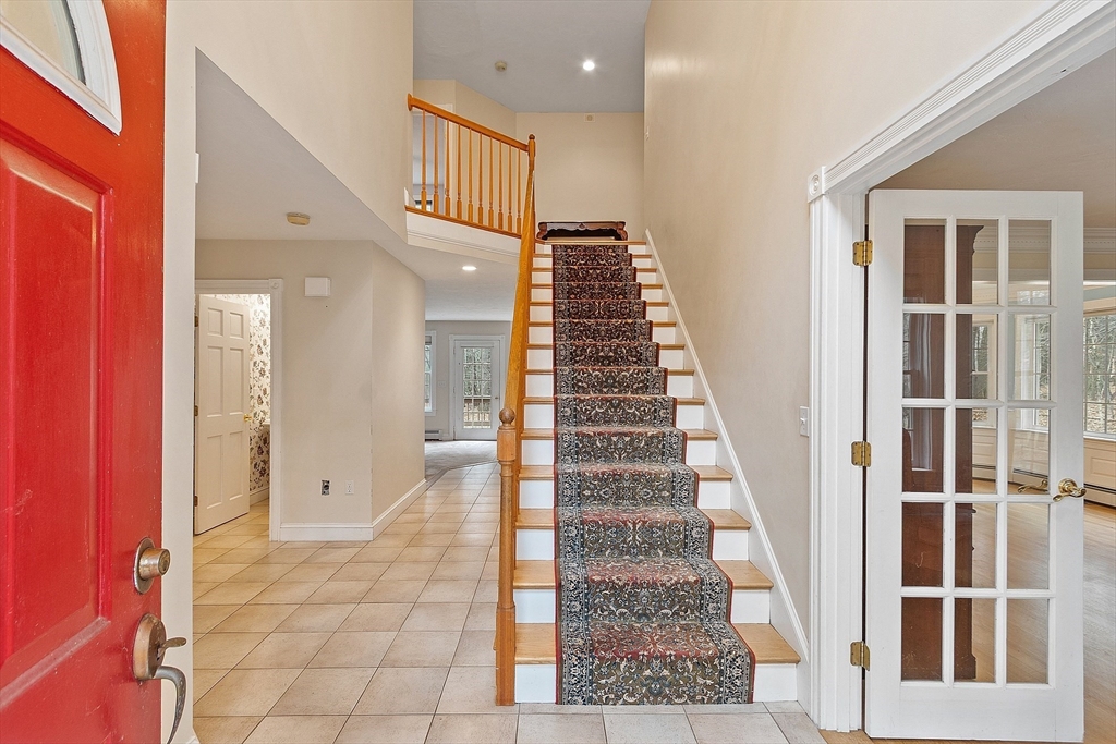 96 Cedarwood Road Boxborough, MA 01719 - Photo 3 of 41 a view of staircase with white walls and windows