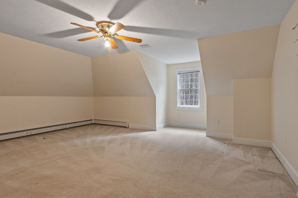 96 Cedarwood Road Boxborough, MA 01719 - Photo 31 of 41 an empty room with windows and fan