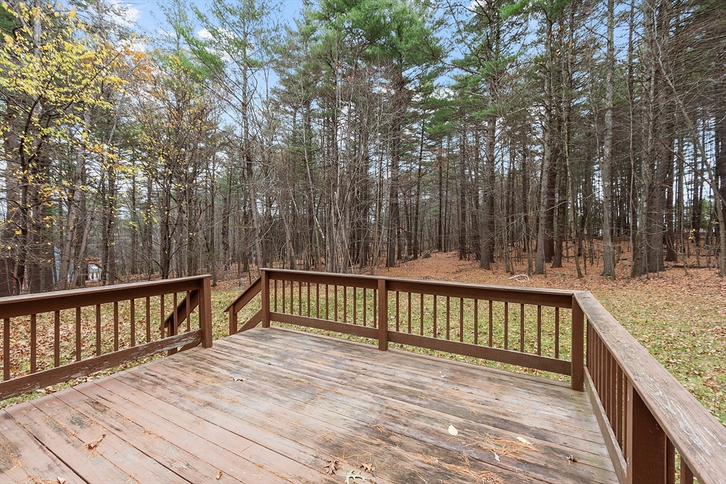 96 Cedarwood Road Boxborough, MA 01719 - Photo 40 of 41 a view of deck with wooden floor and fence