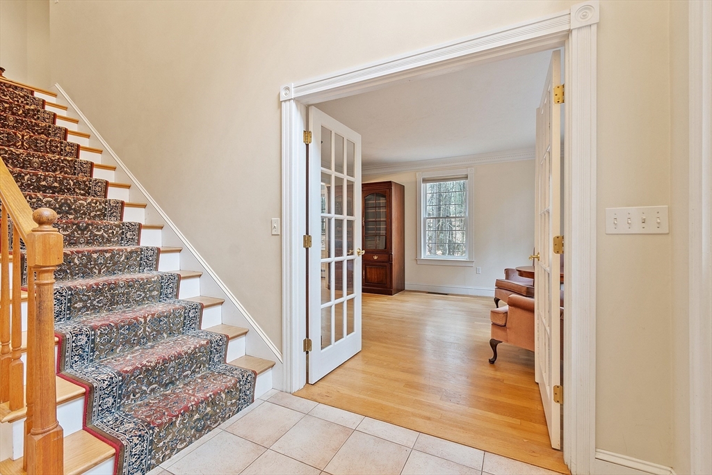 96 Cedarwood Road Boxborough, MA 01719 - Photo 5 of 41 a view of a hallway view with living room and wooden floor