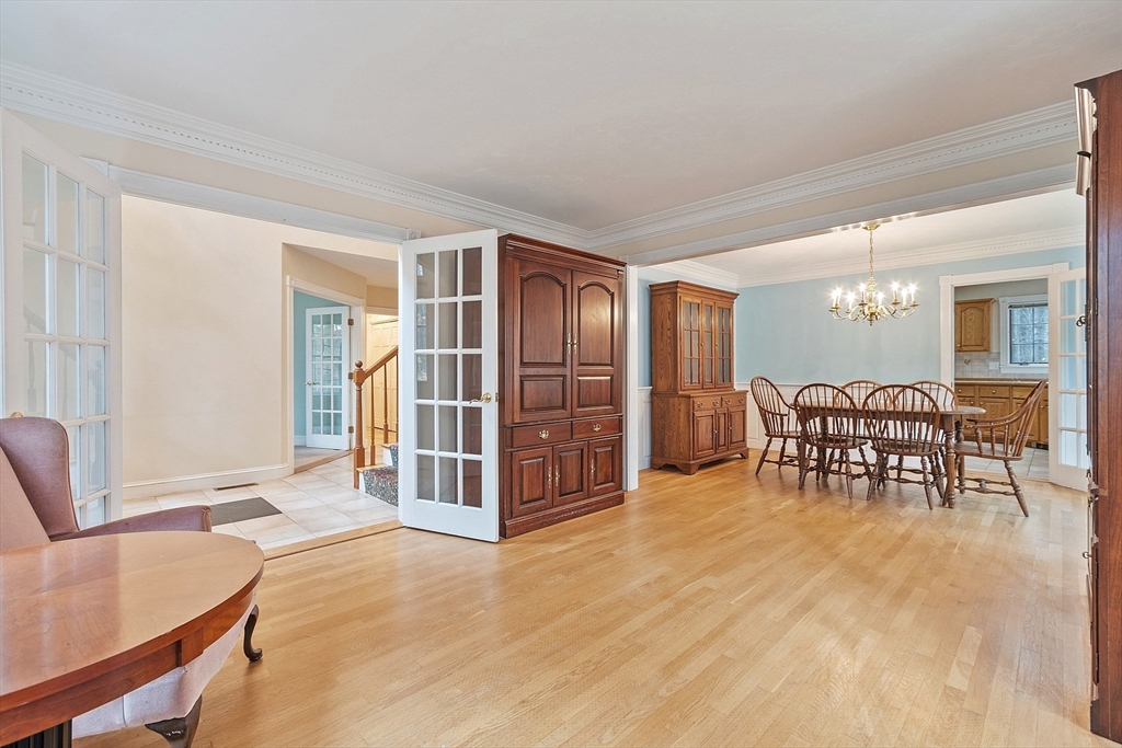 96 Cedarwood Road Boxborough, MA 01719 - Photo 6 of 41 a living room with furniture a dining table and a flat screen tv