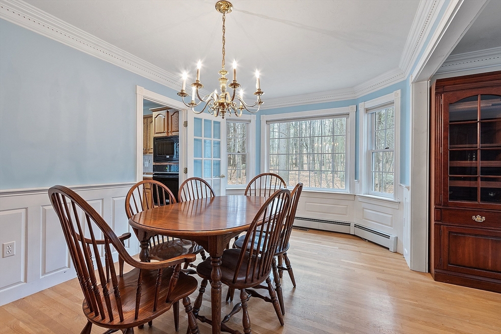 96 Cedarwood Road Boxborough, MA 01719 - Photo 9 of 41 a dining room with furniture window and wooden floor
