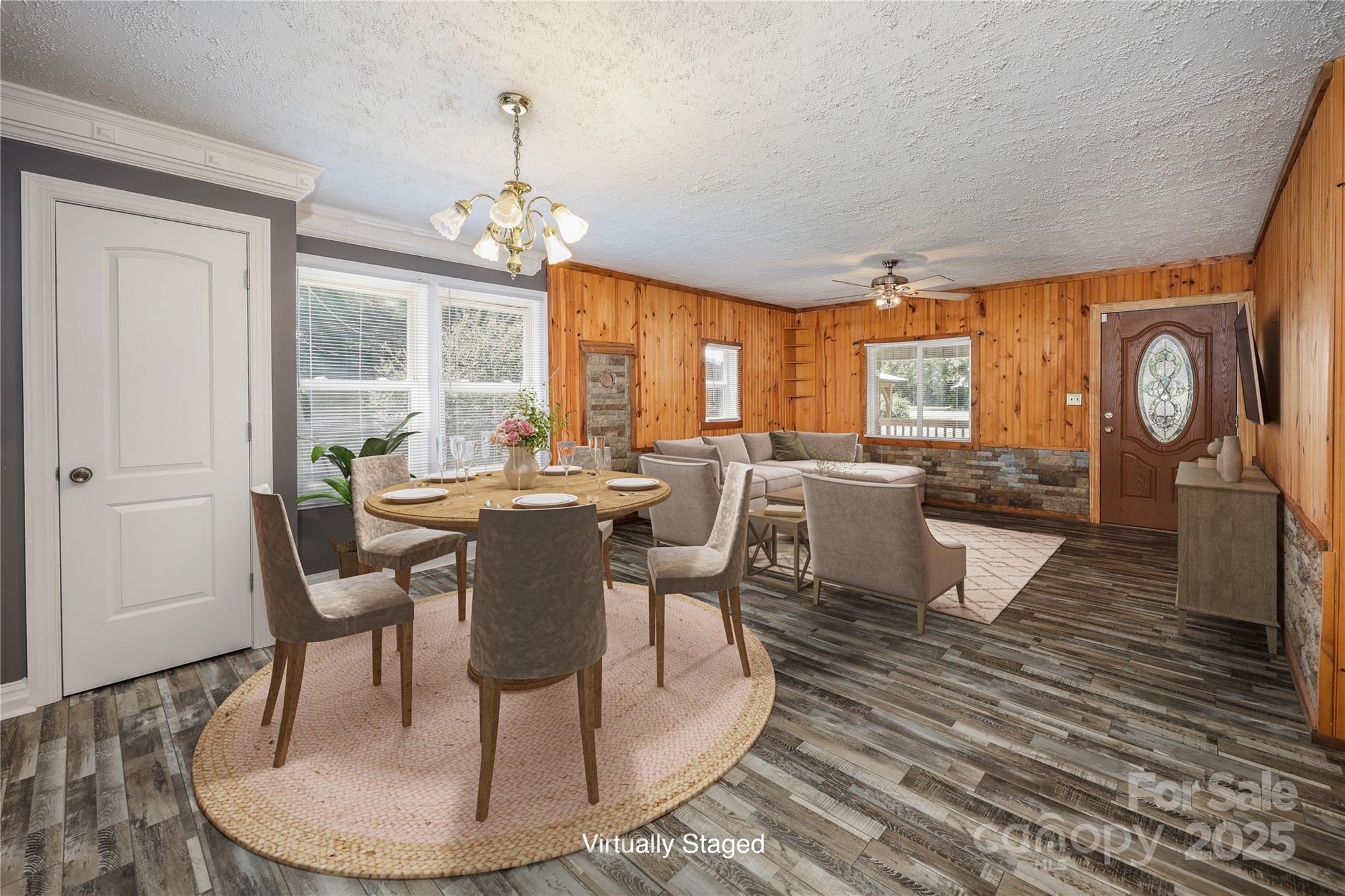 4651 Shiptontown Road, Unit 46 Denton, NC 27239 - Photo 12 of 48 a dining room with wooden floor a chandelier a wooden table and chairs