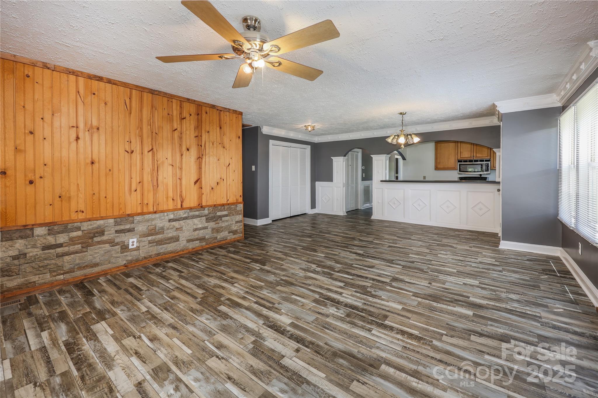 4651 Shiptontown Road, Unit 46 Denton, NC 27239 - Photo 13 of 48 a view of a kitchen with wooden floor and a ceiling fan