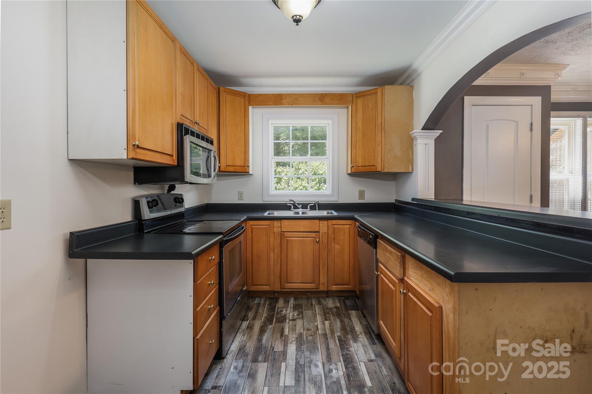4651 Shiptontown Road, Unit 46 Denton, NC 27239 - Photo 16 of 48 a kitchen with granite countertop a sink and a stove