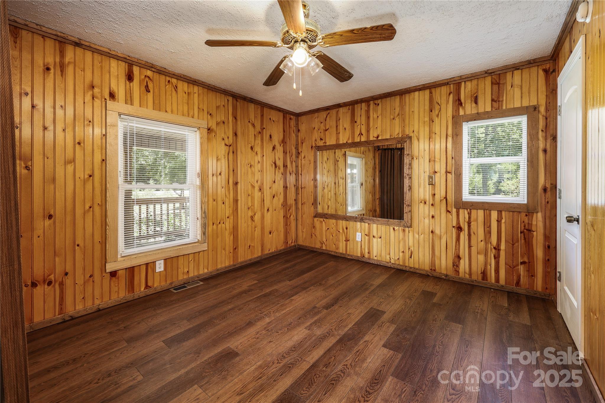 4651 Shiptontown Road, Unit 46 Denton, NC 27239 - Photo 20 of 48 a view of an empty room with a window and wooden floor