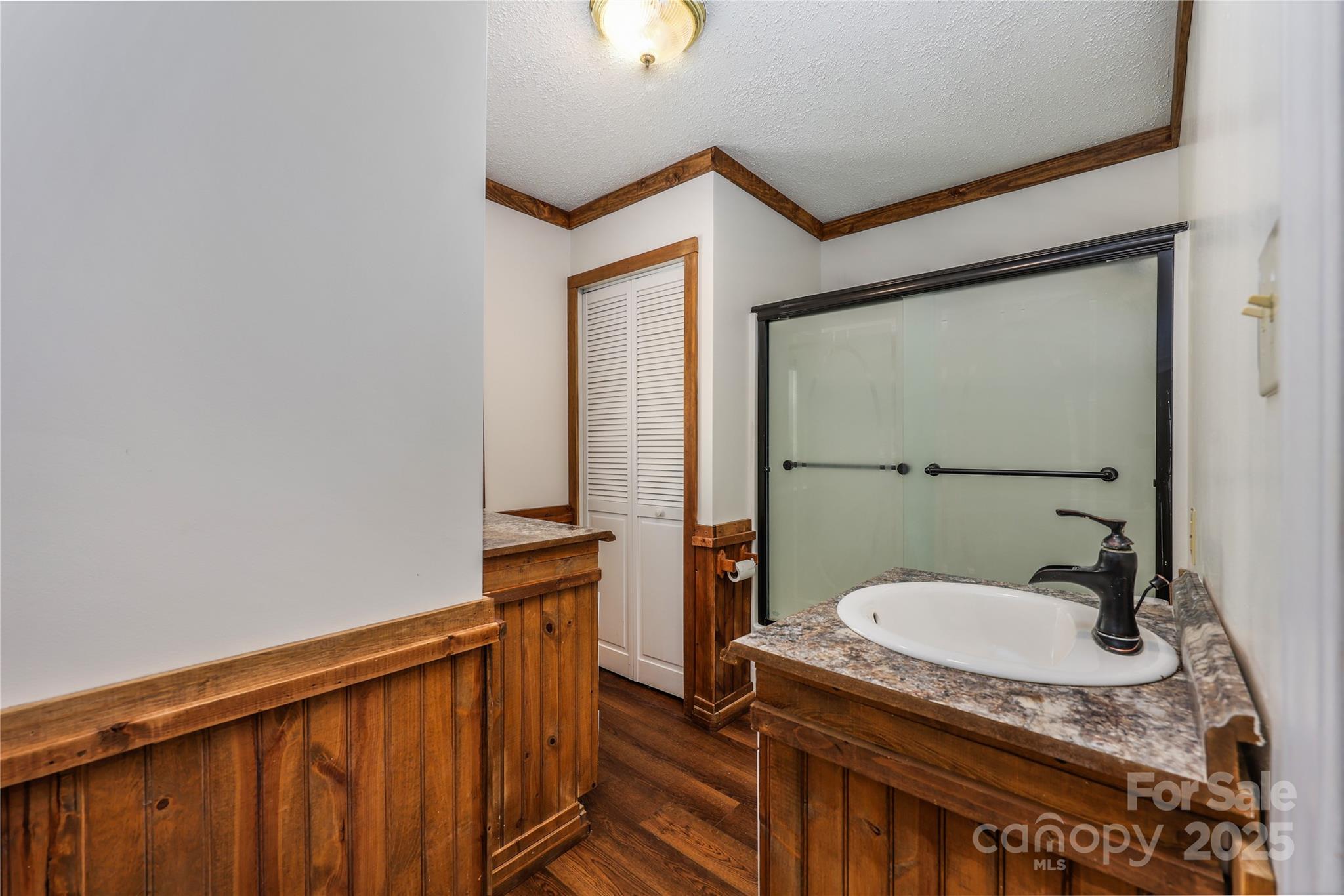 4651 Shiptontown Road, Unit 46 Denton, NC 27239 - Photo 22 of 48 a bathroom with a granite countertop sink and mirror