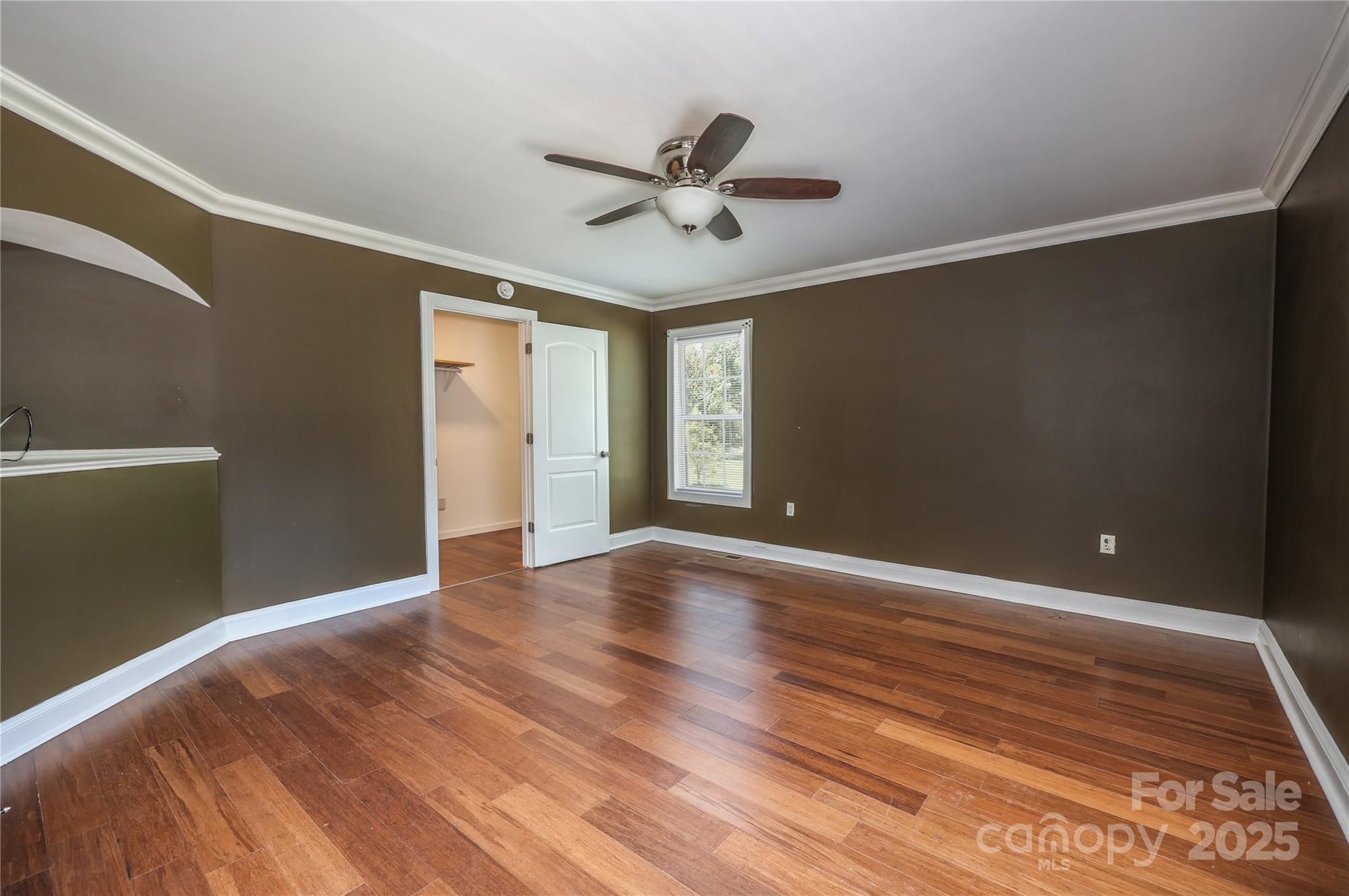 4651 Shiptontown Road, Unit 46 Denton, NC 27239 - Photo 27 of 48 a view of an empty room with window and wooden floor