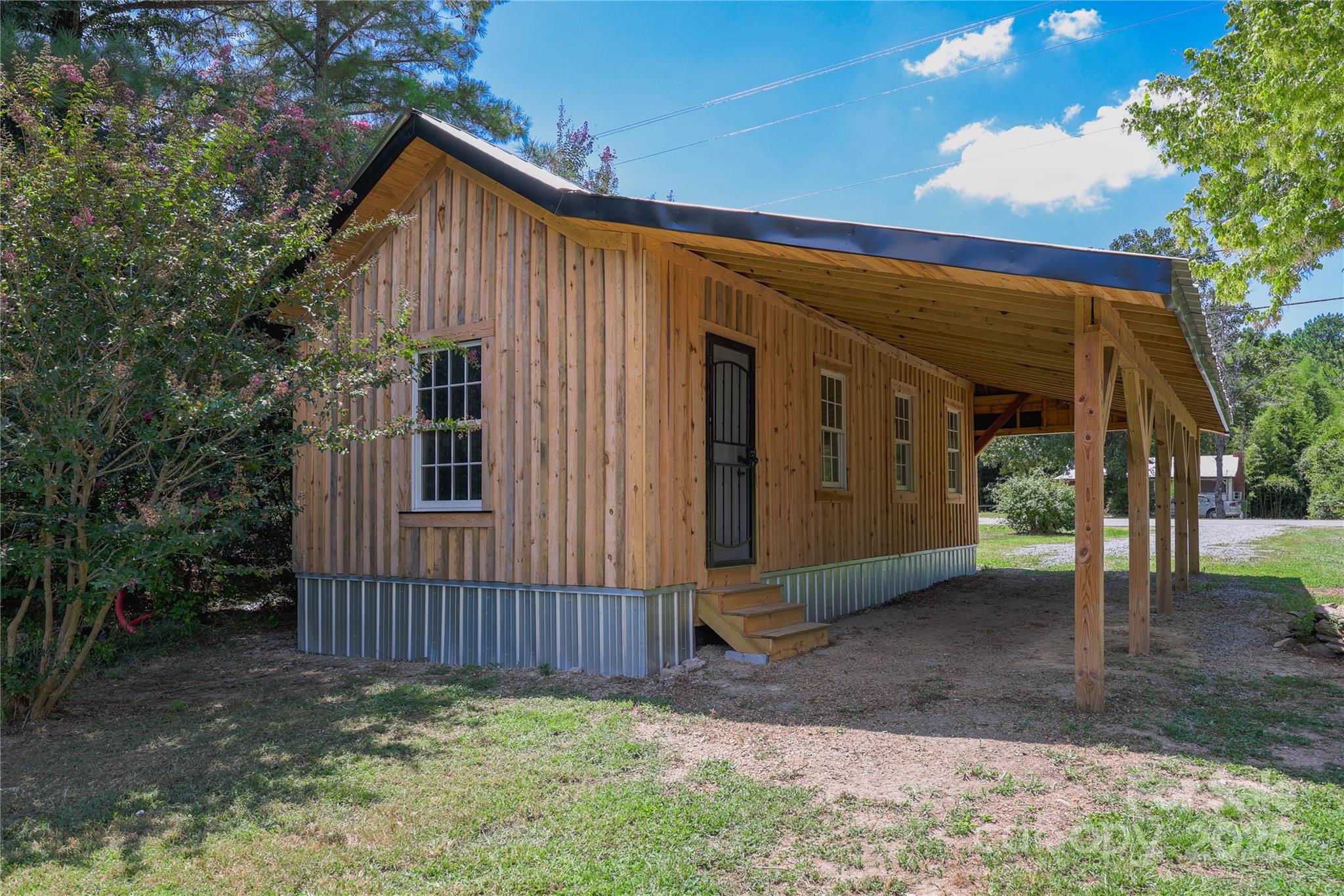 4651 Shiptontown Road, Unit 46 Denton, NC 27239 - Photo 30 of 48 a view of a house with a yard