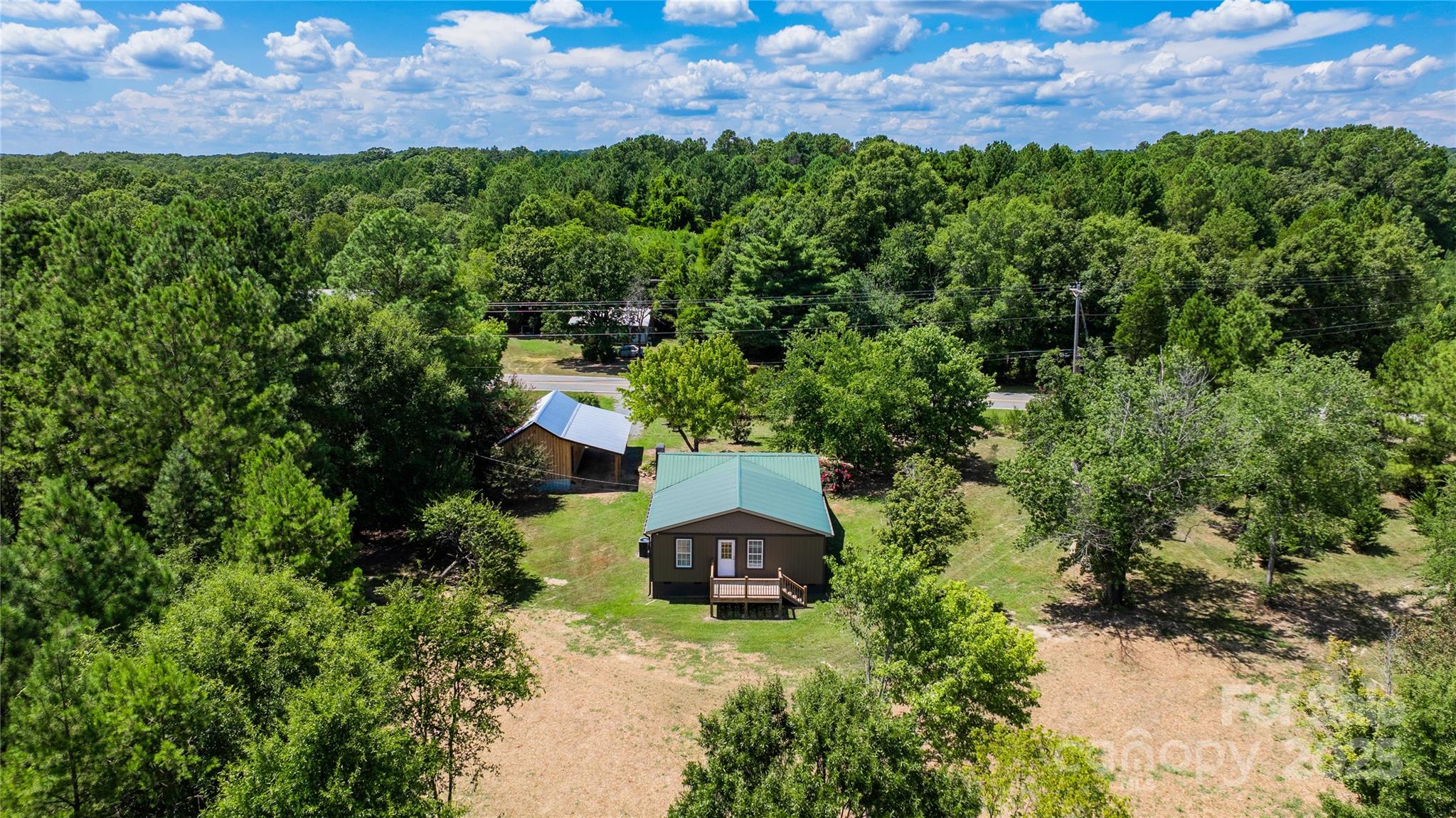 4651 Shiptontown Road, Unit 46 Denton, NC 27239 - Photo 42 of 48 an aerial view of a house with a yard
