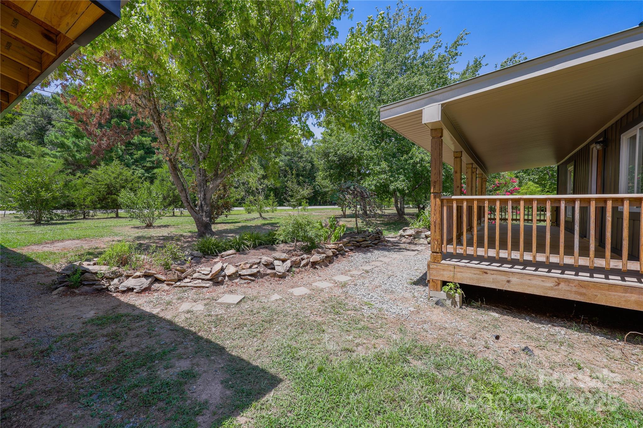 4651 Shiptontown Road, Unit 46 Denton, NC 27239 - Photo 8 of 48 a view of backyard with deck and trees