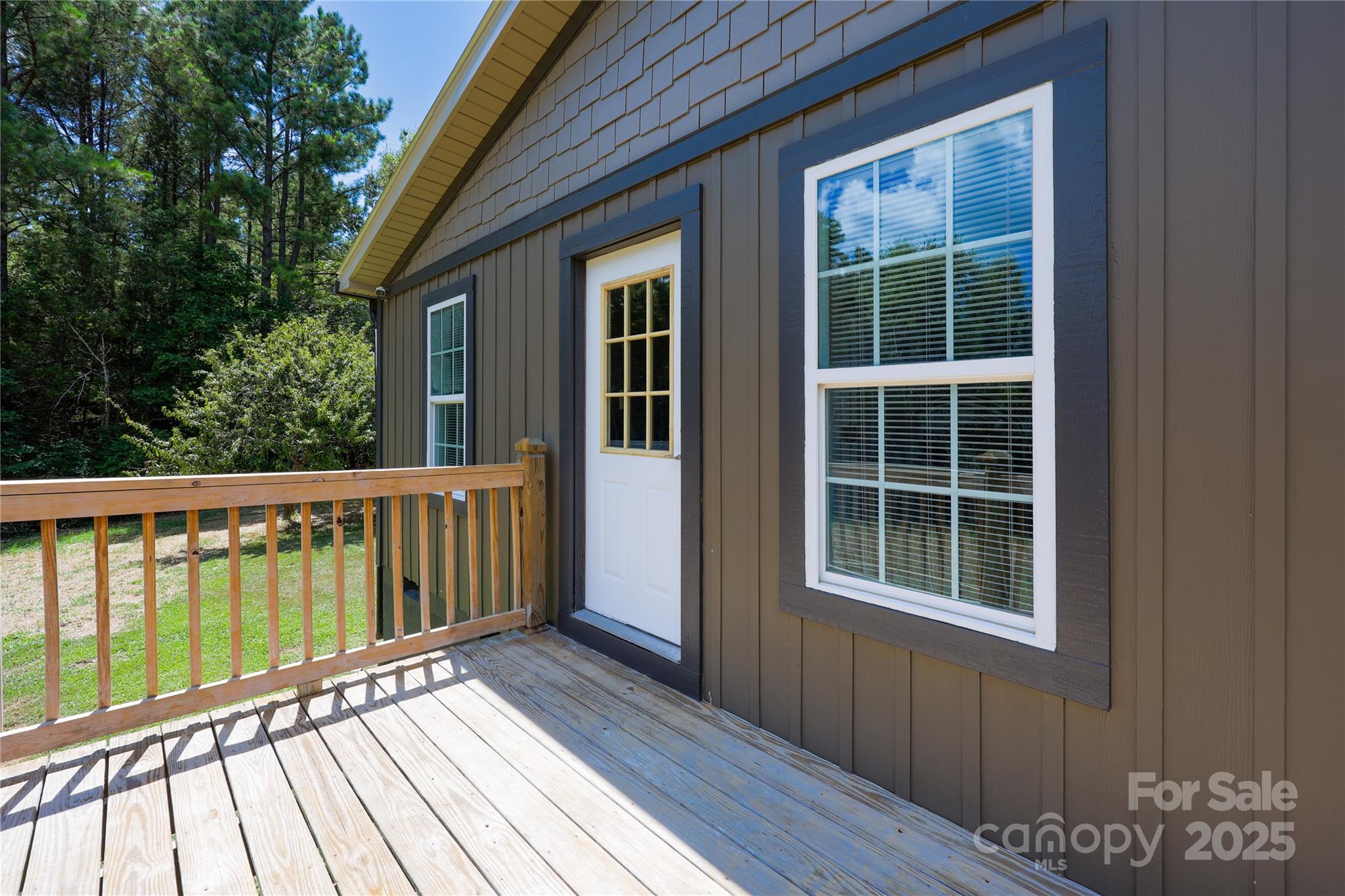 4651 Shiptontown Road, Unit 46 Denton, NC 27239 - Photo 9 of 48 a view of a deck with wooden floor and fence