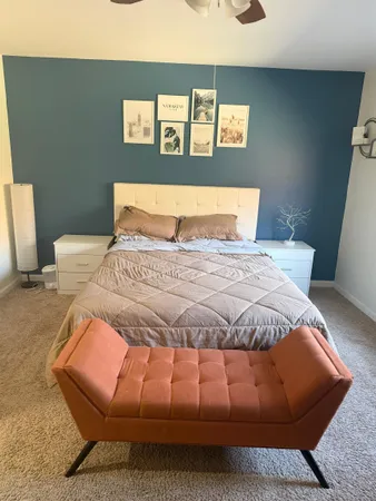 a bedroom with a bed and window