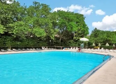 a view of a swimming pool with an outdoor space and seating area