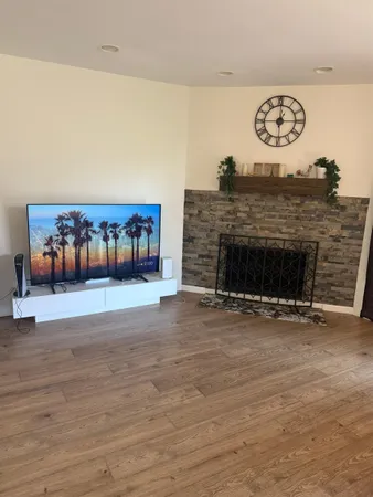 a view of a livingroom with furniture and a fireplace
