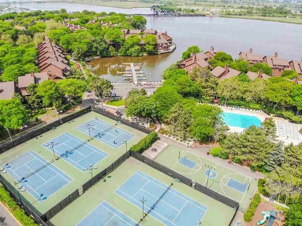 a view of swimming pool and green space