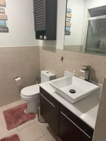 a bathroom with a sink and a toilet