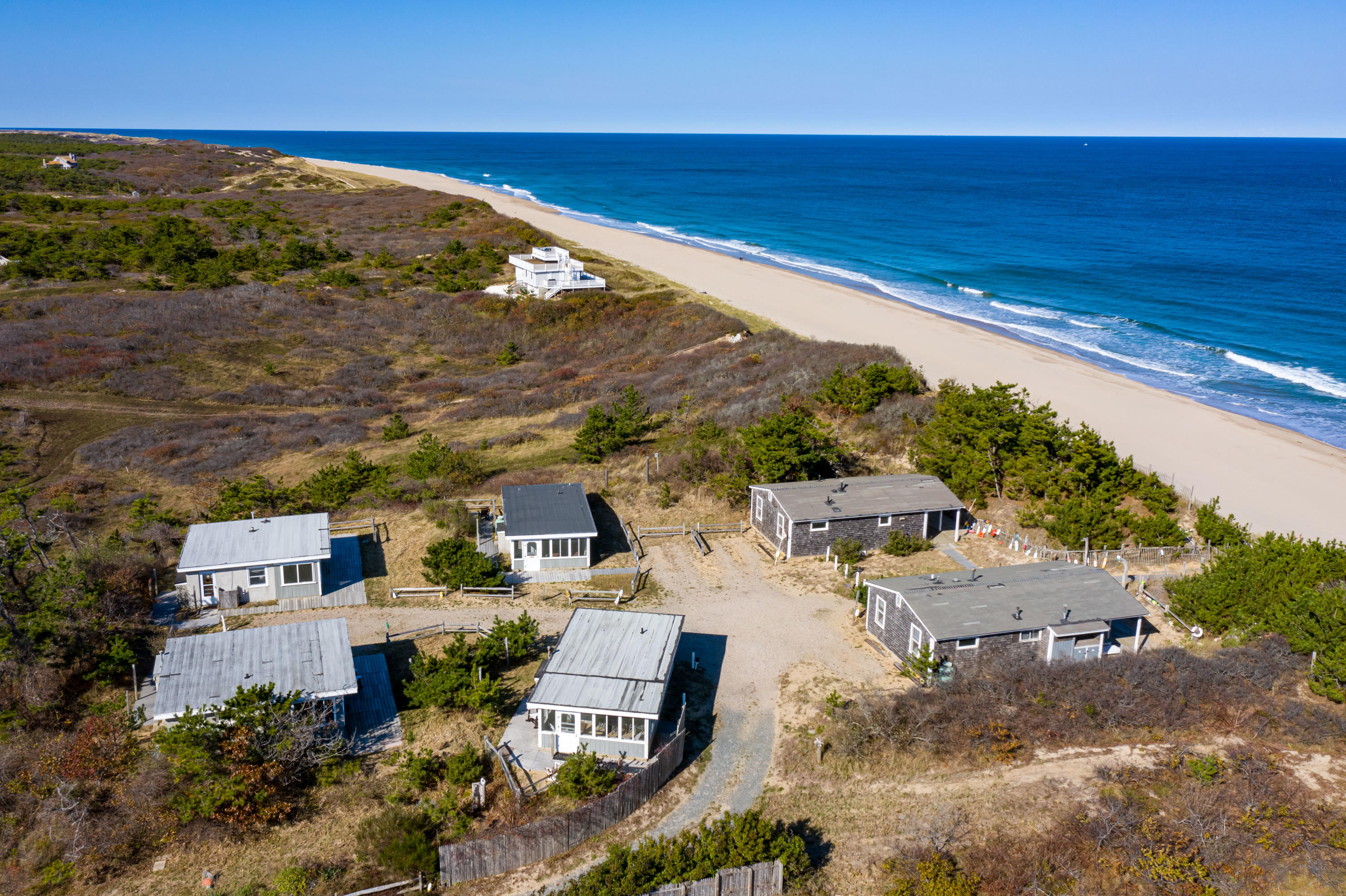 17 Coast Guard Road Truro, MA 02666 - Photo 2 of 19 an aerial view of residential houses with outdoor space