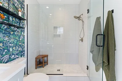 a bathroom with a shower and a toilet