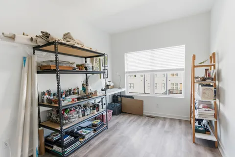 a bedroom with furniture and a window