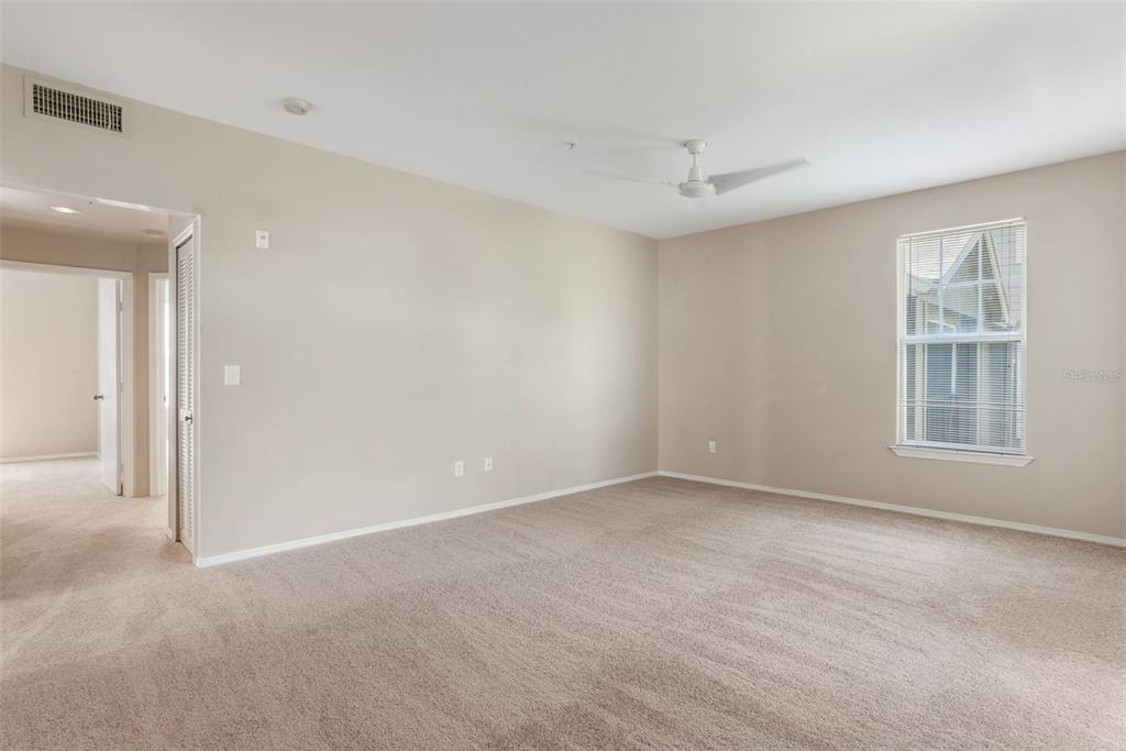 408 Summit Ridge Place, Unit 210 Longwood, FL 32779 - Photo 11 of 32 a view of an empty room with a window