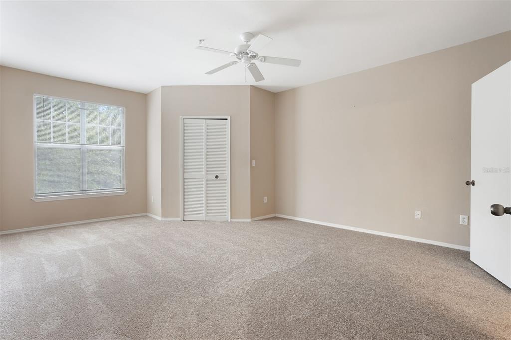 408 Summit Ridge Place, Unit 210 Longwood, FL 32779 - Photo 12 of 32 a view of an empty room with a window