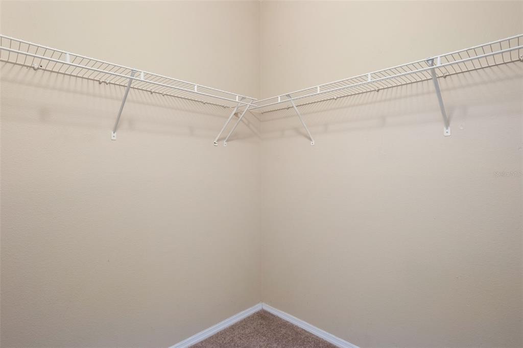 408 Summit Ridge Place, Unit 210 Longwood, FL 32779 - Photo 18 of 32 a view of a room with racks on the wall