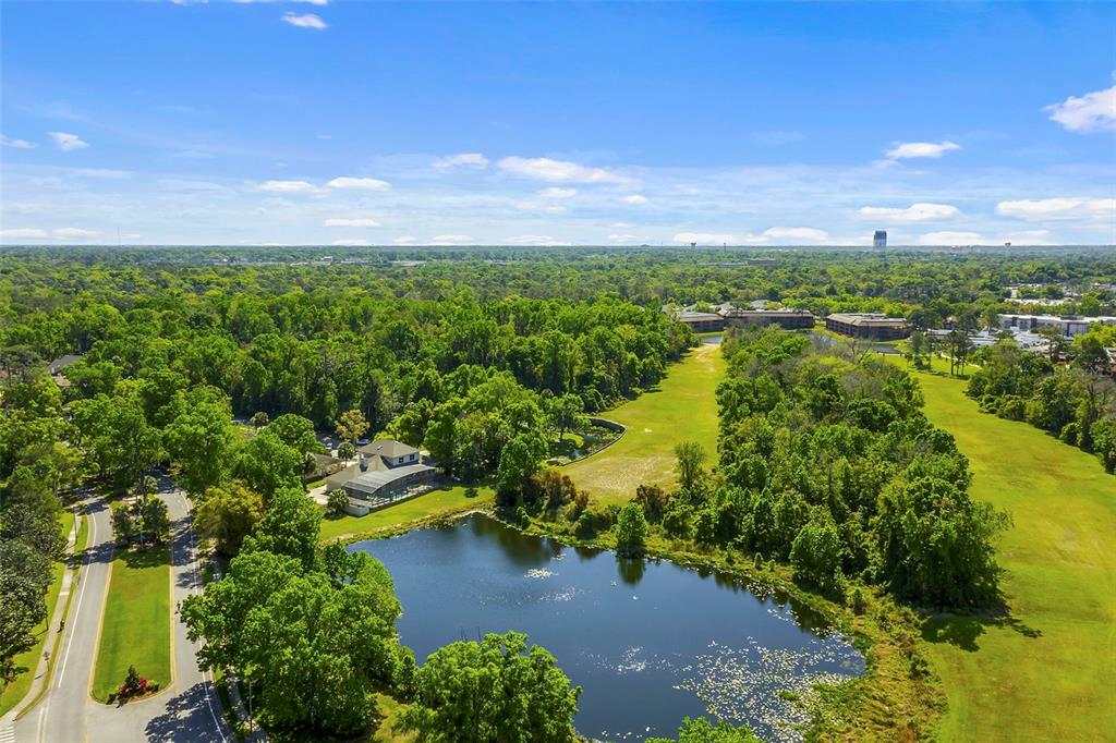 408 Summit Ridge Place, Unit 210 Longwood, FL 32779 - Photo 28 of 32 a view of lake with green space