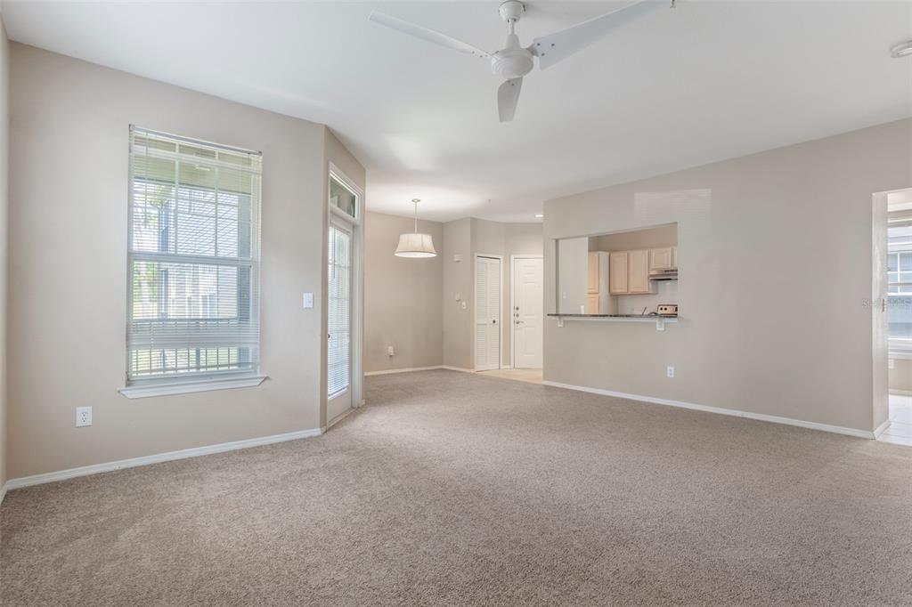 408 Summit Ridge Place, Unit 210 Longwood, FL 32779 - Photo 5 of 32 a view of an empty room with a window