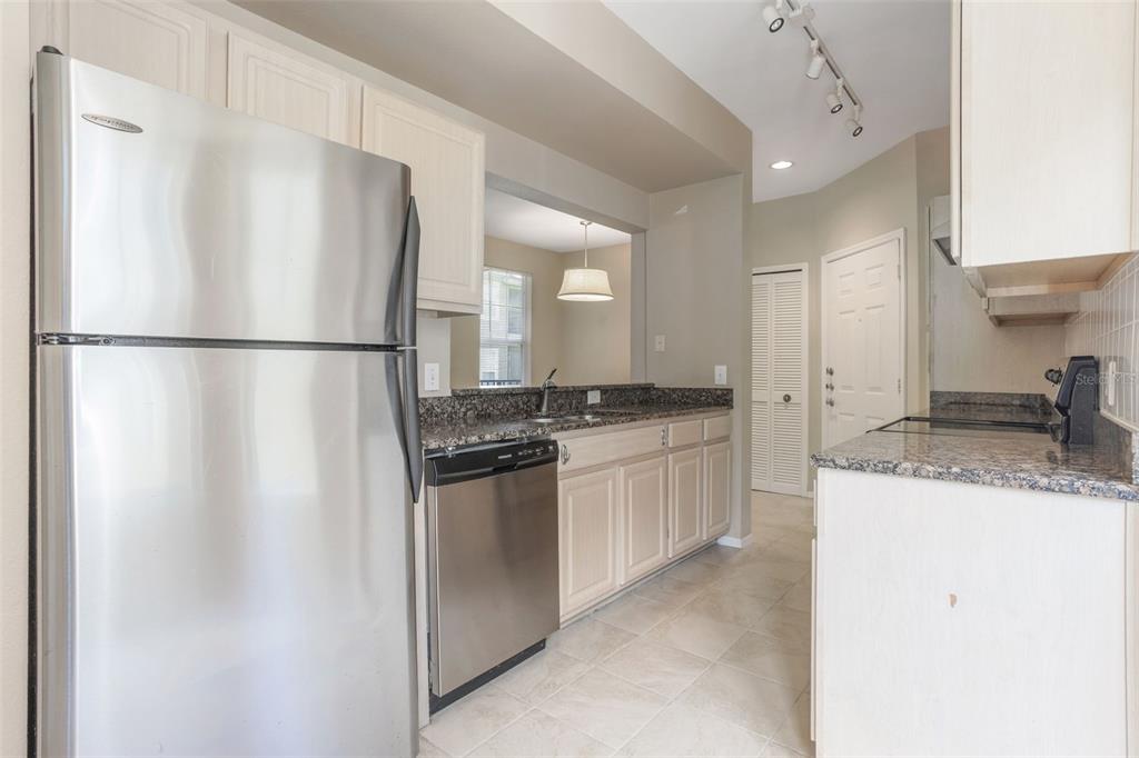 408 Summit Ridge Place, Unit 210 Longwood, FL 32779 - Photo 7 of 32 a kitchen with a refrigerator sink and stove