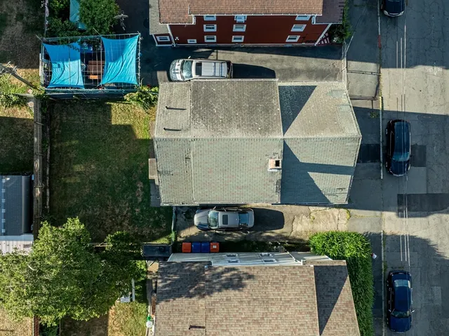 an aerial view of a house with swimming pool