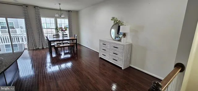 a view of a workspace with wooden floor