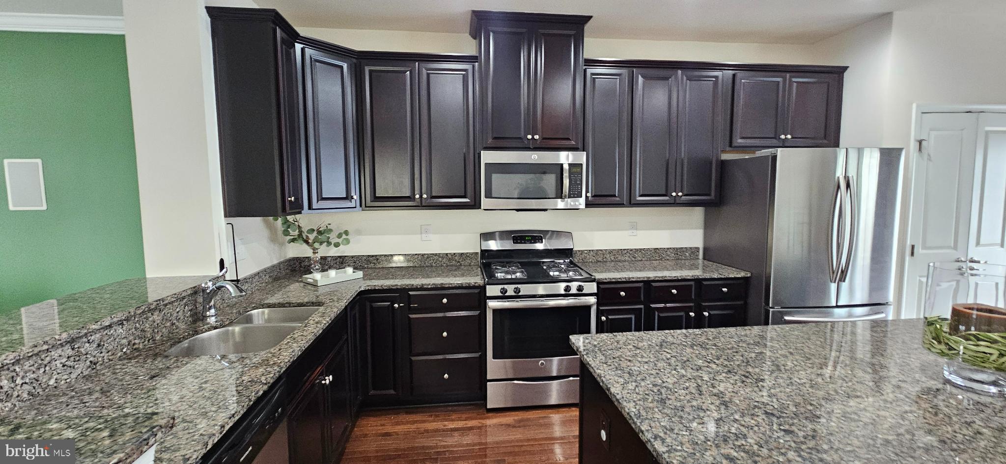 420 Lopata Road Phoenixville, PA 19460 - Photo 18 of 38 a kitchen with a stove a sink and a refrigerator