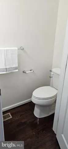 a bathroom with a toilet and a sink