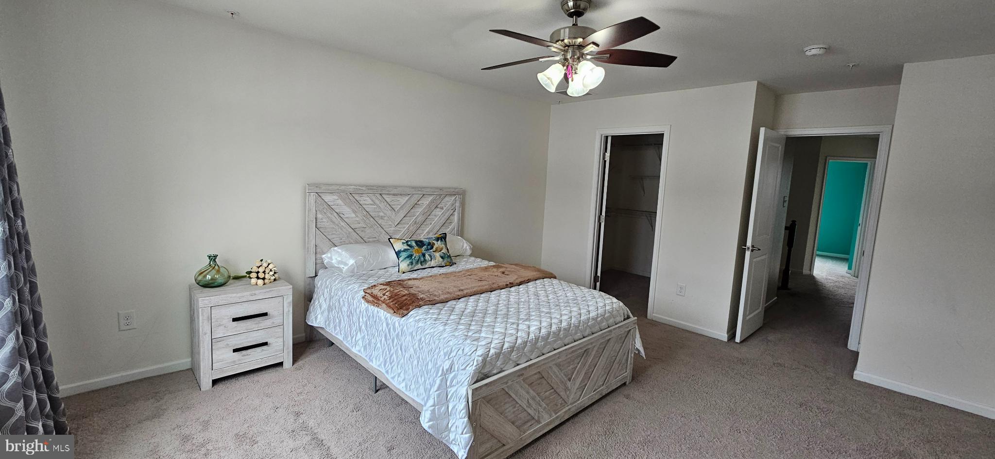 420 Lopata Road Phoenixville, PA 19460 - Photo 25 of 38 a bedroom with a bed and a chandelier