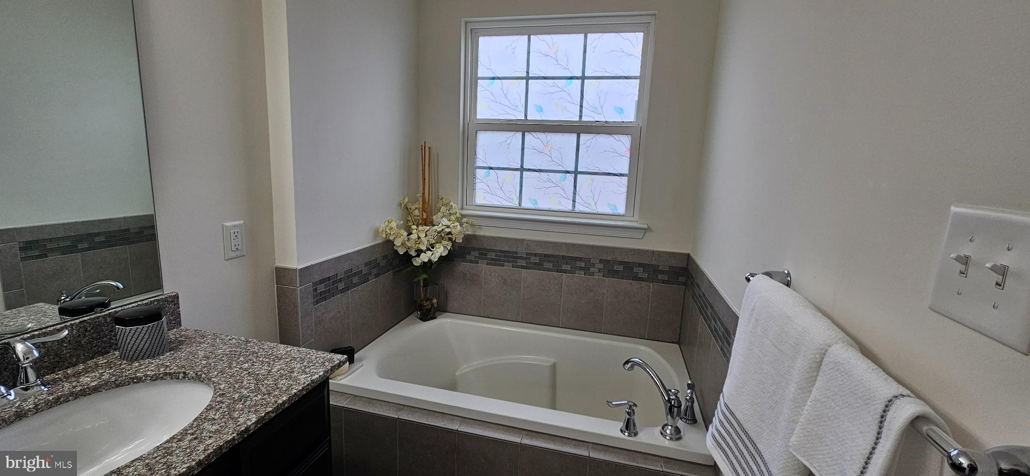 420 Lopata Road Phoenixville, PA 19460 - Photo 28 of 38 a bathroom with a granite countertop tub sink and mirror