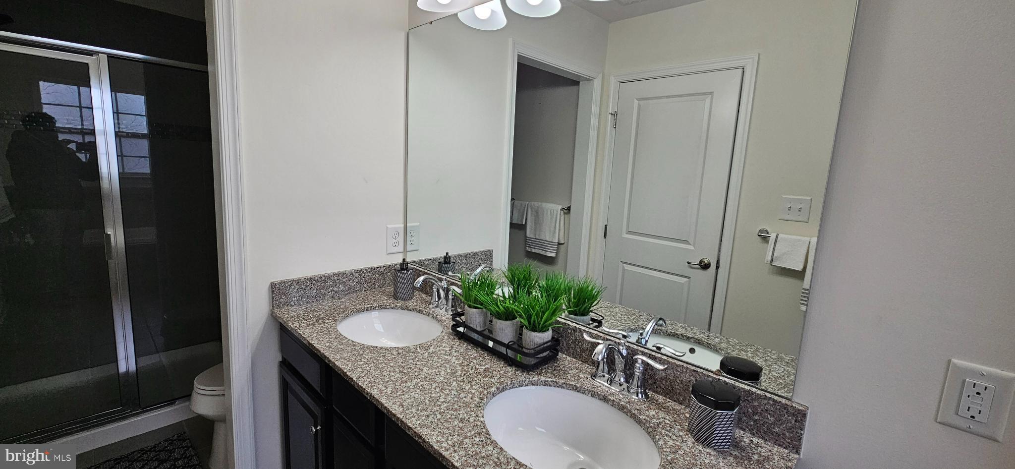 420 Lopata Road Phoenixville, PA 19460 - Photo 29 of 38 a bathroom with a granite countertop sink a mirror and shower