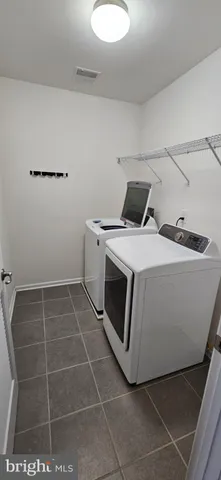 a utility room with washer and dryer