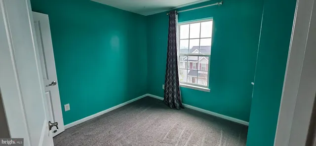 a view of a room that has a window