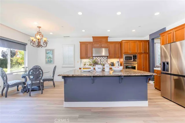 a view of a hallway with wooden floor and closet