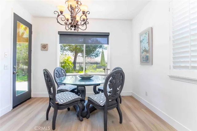 a spacious bedroom with a bed and glass window