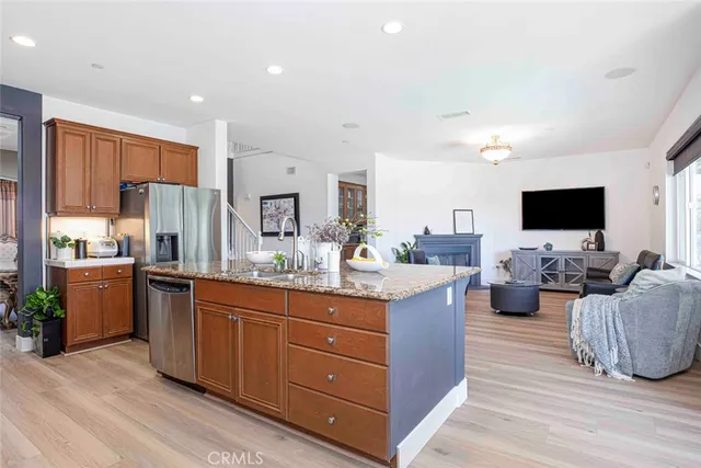 a bedroom with a bed and dresser with mirror