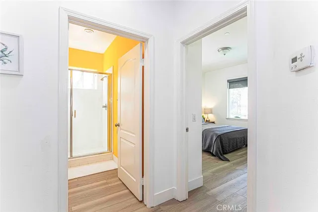 a bathroom with a granite countertop sink mirror and a bathtub