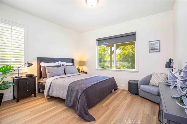 a bathroom with a granite countertop sink a mirror and a bathtub