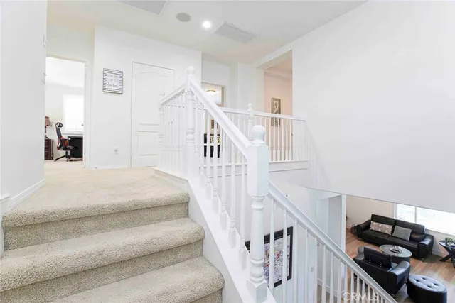 a bedroom with a bed a table and a window