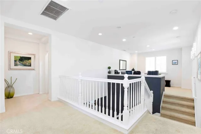 a bedroom with a bed and a large mirror