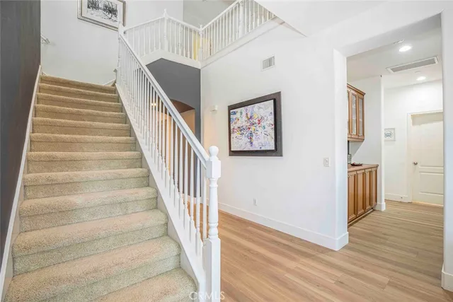 a living room with furniture and a large mirror